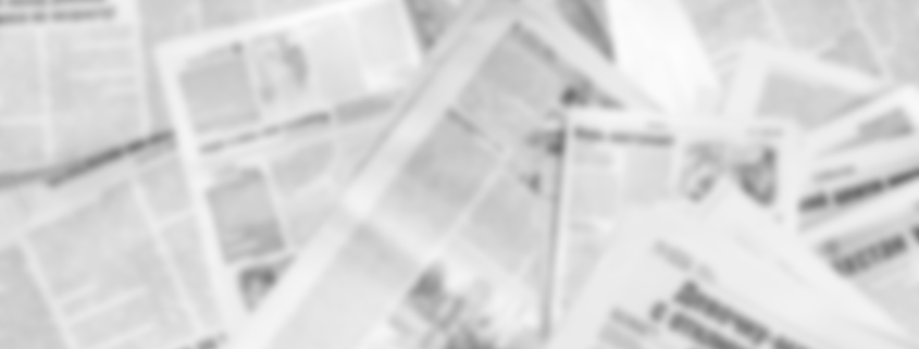 Abstract blurred image of old newspapers. Media news concept.