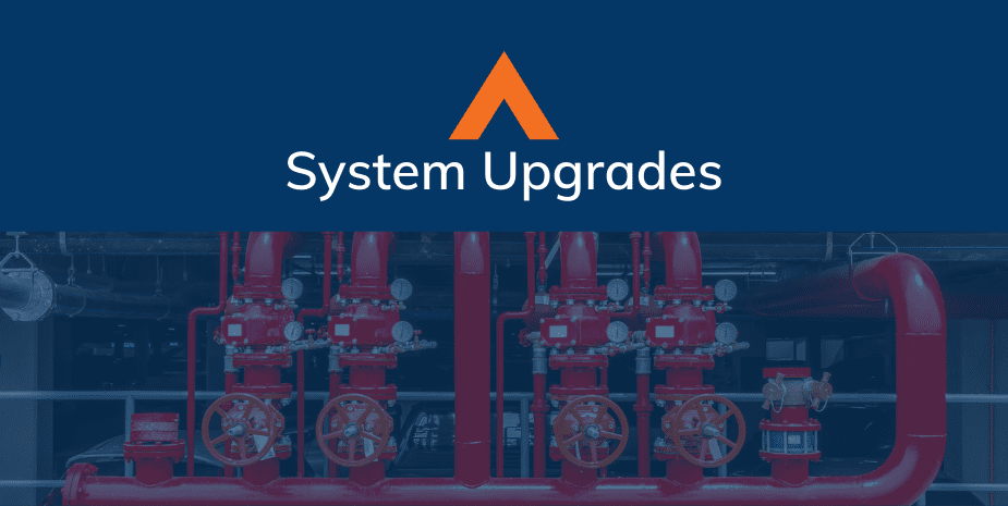 photo of pipes with a blue overlay and blue header that says system upgrades in white text